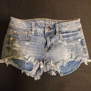 Distressed denim shorts